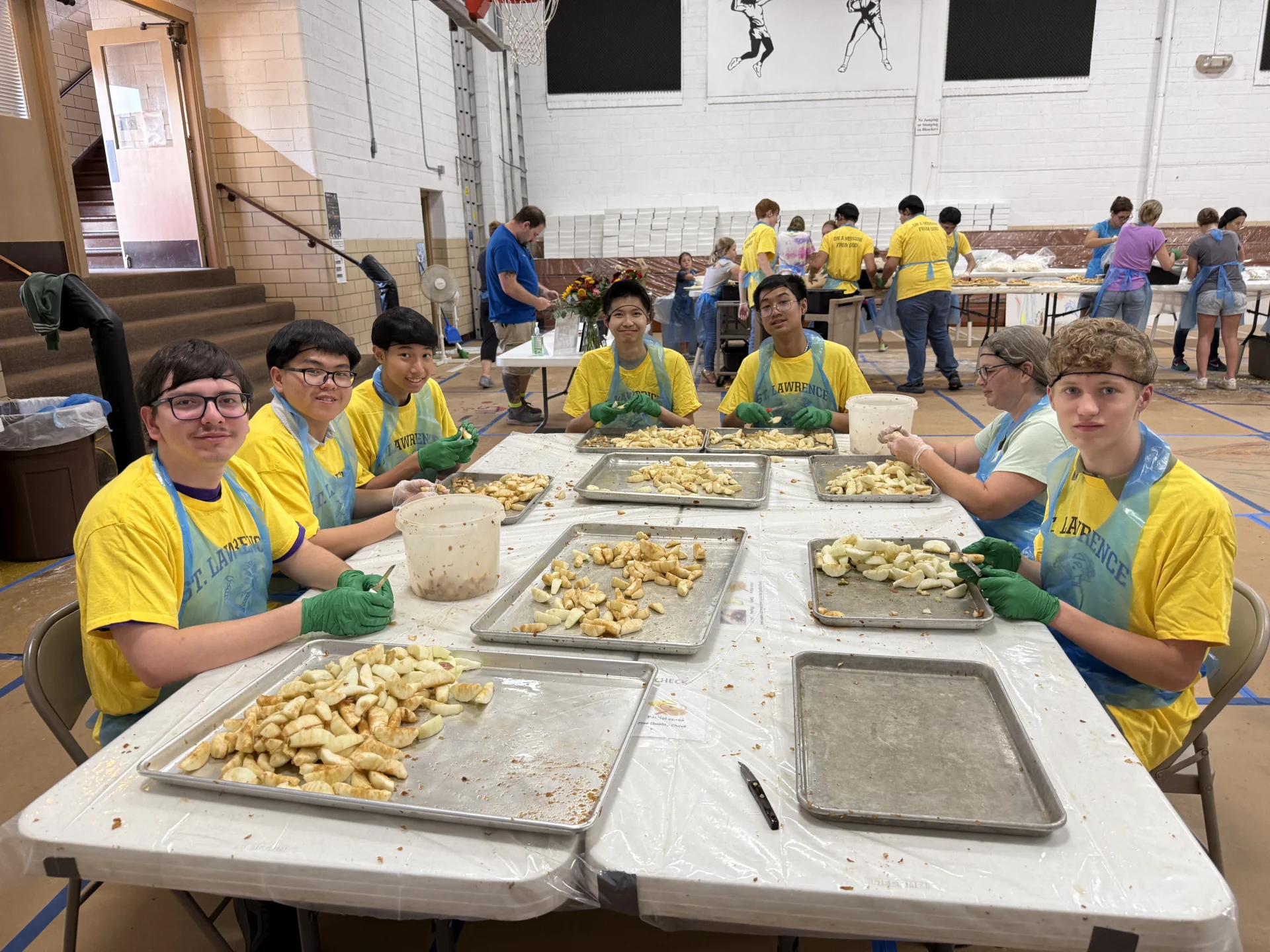 students raking leaves