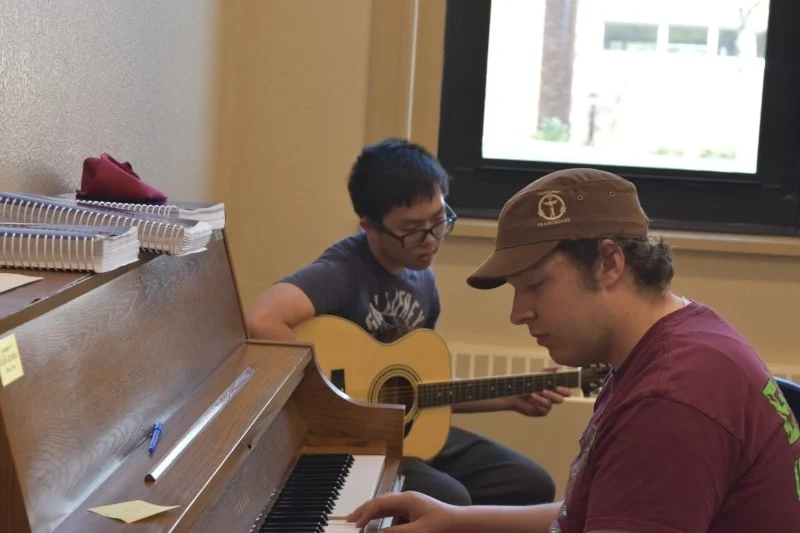 students playing music together