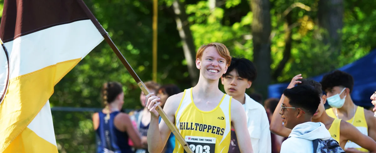 track student with school flag