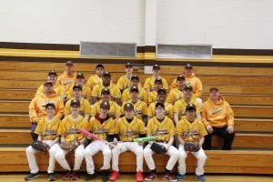 baseball team sitting on bleachers