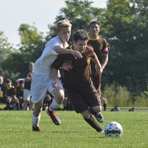 students playing soccer