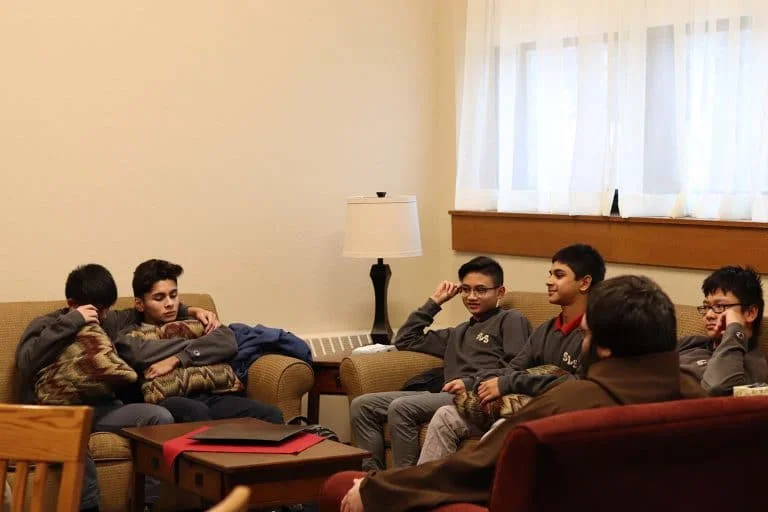 students on couches talking
