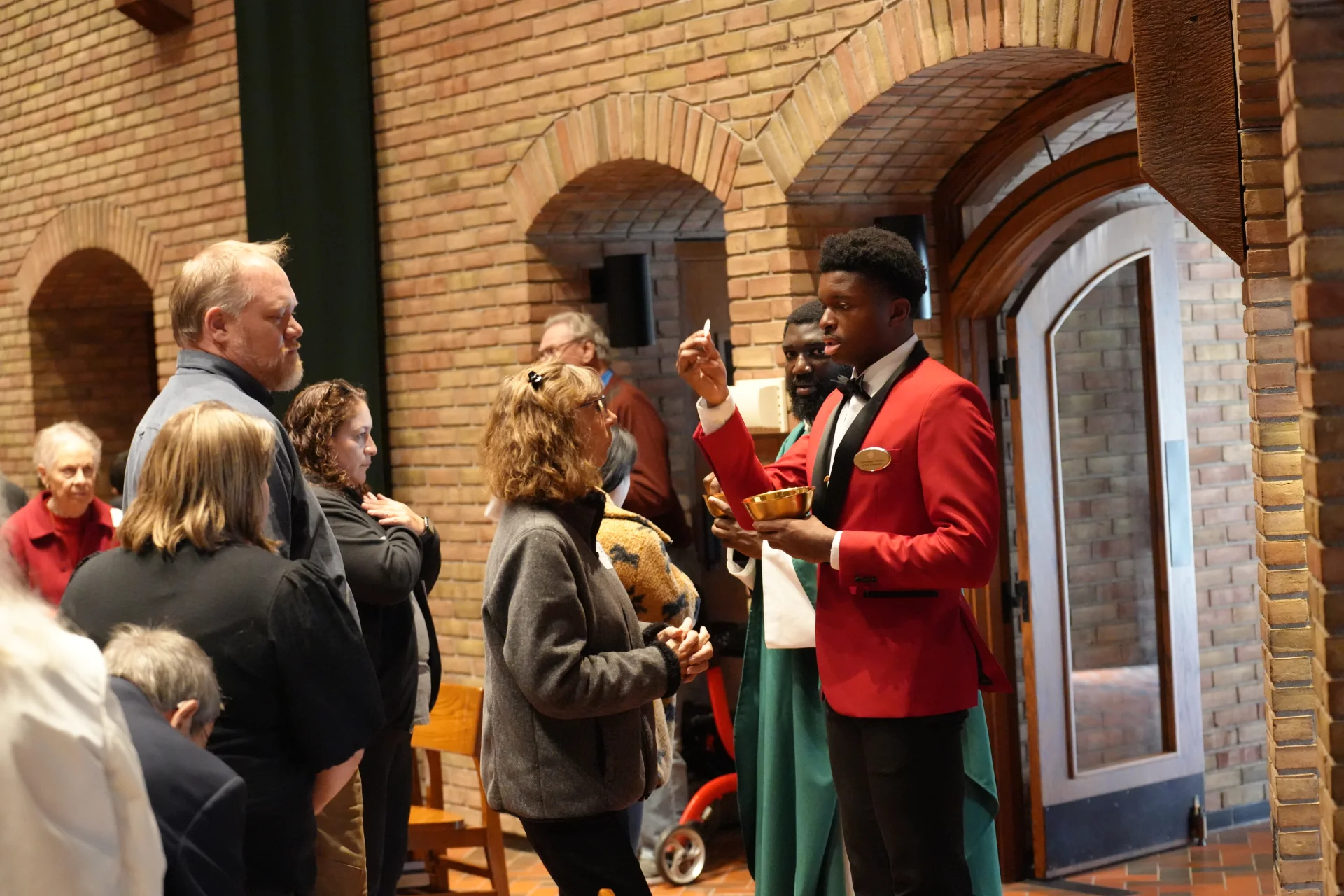 SLS student offering Communion
