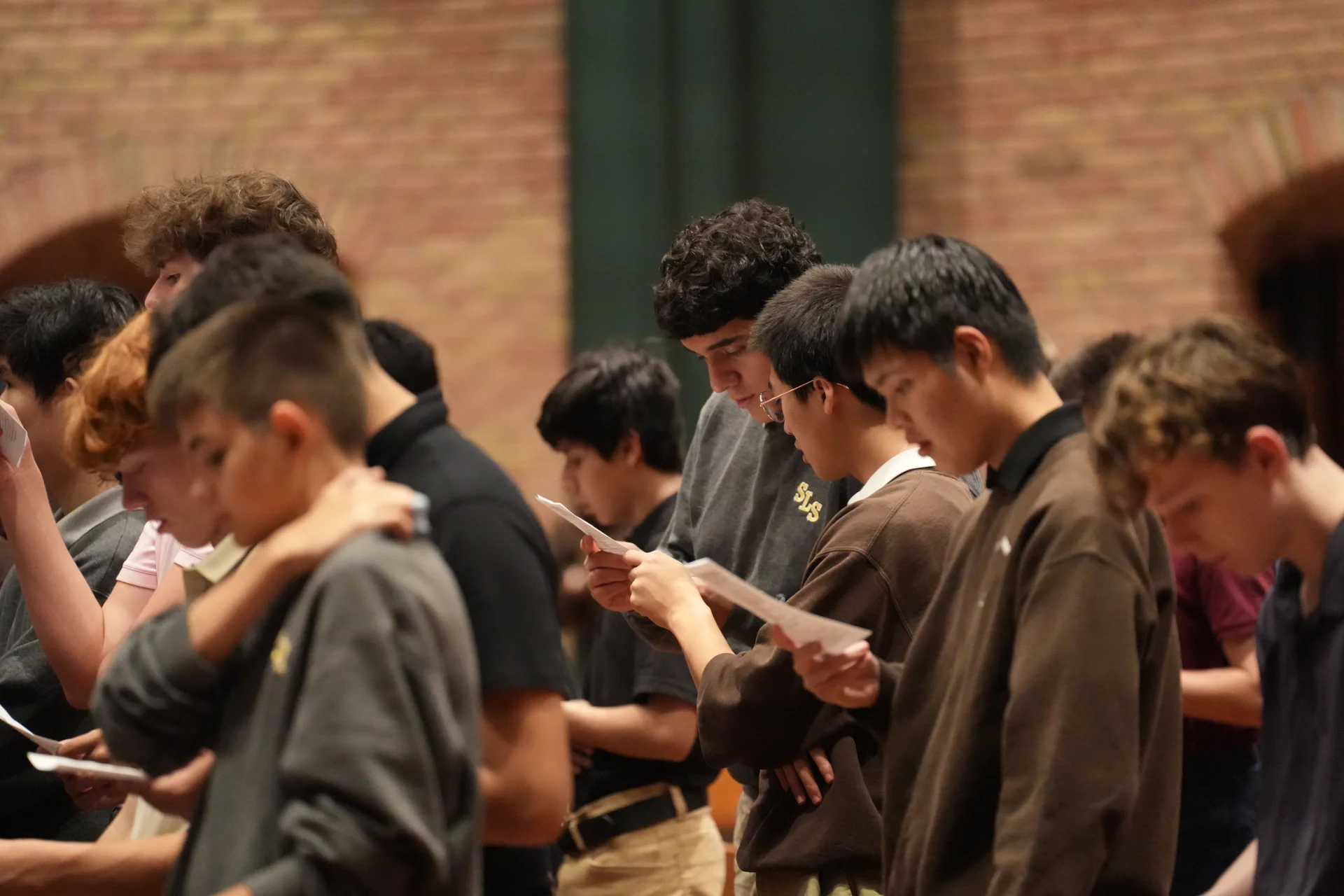 Students saying prayer together at St. Lawrence Seminary High School